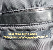 Load image into Gallery viewer, View of inside pocket of women's black leather jacket size small that reads "New Zealand Lamb" leather