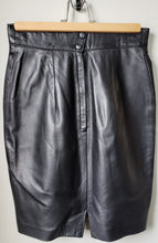 Load image into Gallery viewer, Back of women&#39;s black Danier leather skirt size 2 with back zipper and two button snaps
