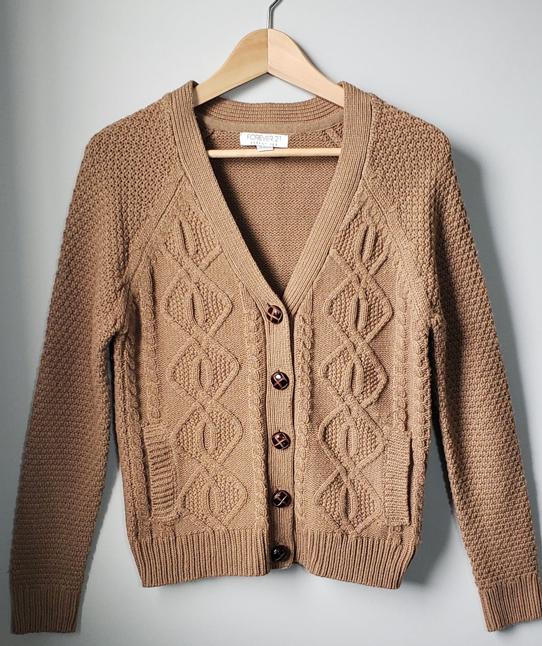 Front of women's Forever 21 grandpa sweater cognac colour with large old style buttons.