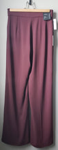 Load image into Gallery viewer, Back view of Babaton Lincoln pants burgundy colour Long inseam, wide pant leg, size 4. Brand new with original tags.
